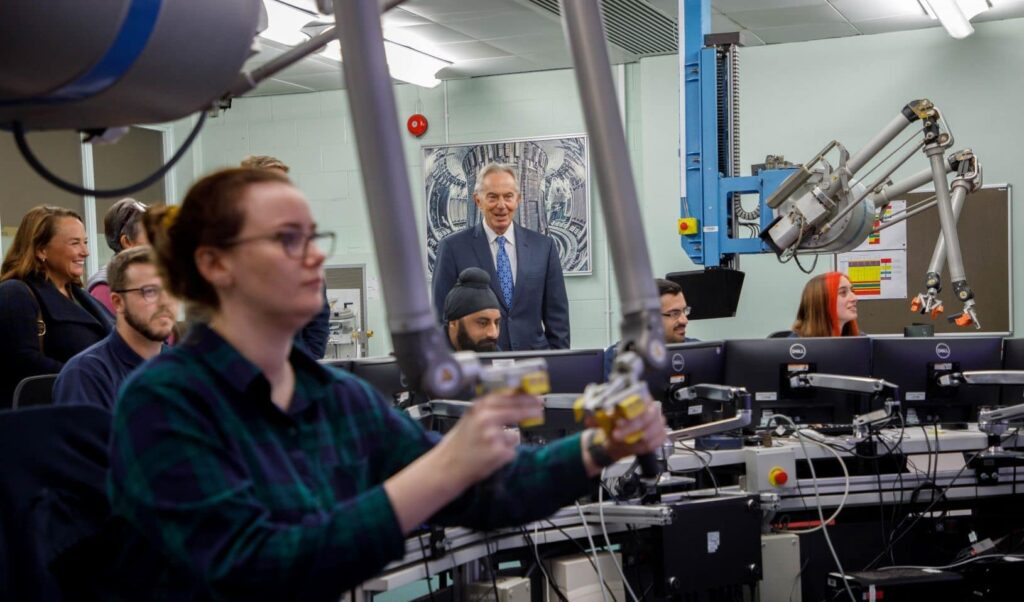 Tony Blair watching experts working at UKAEA.