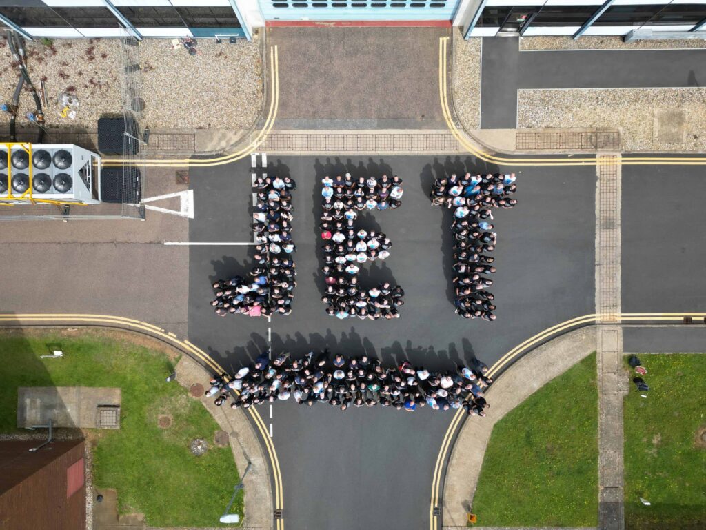 An aerial view of people at UKAEA organised into groups to spell 'JET'