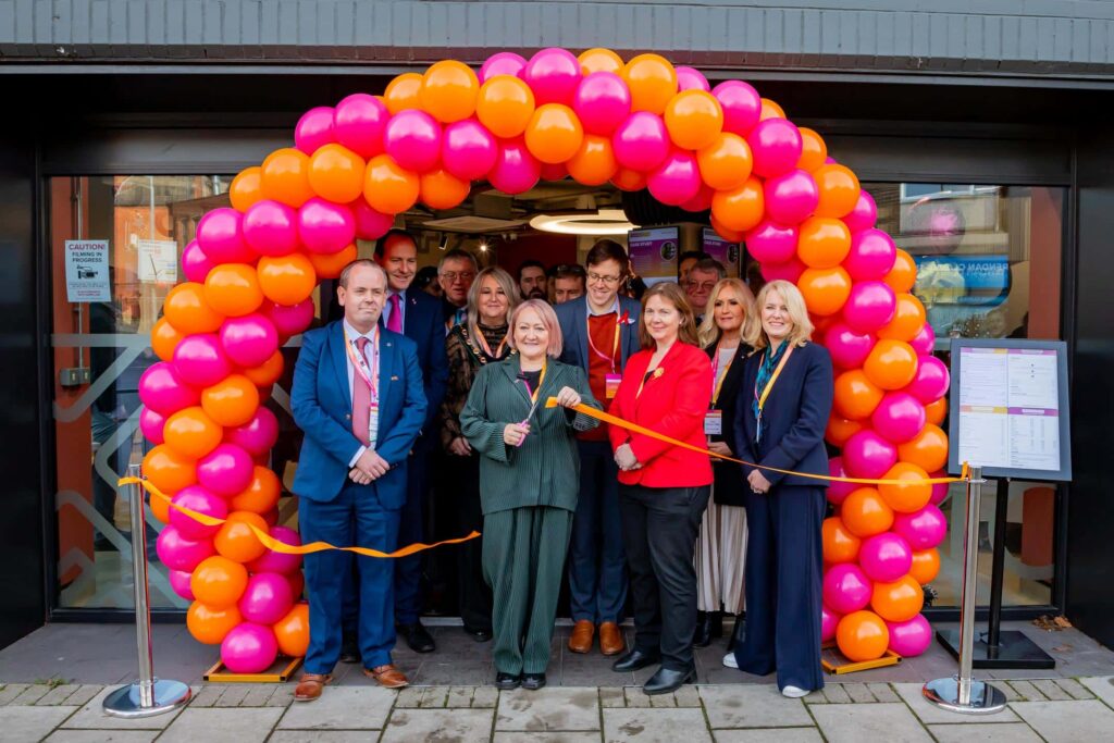 Climate Minister Kerry McCarthy officially opening the Fusion Energy Café in Bridge Skills Hub, Worksop standing in an arc of balloons.