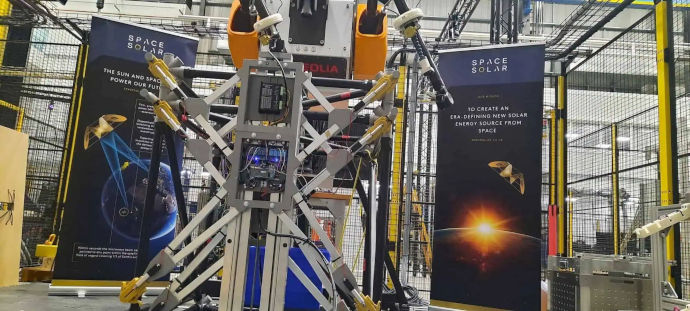 Fusion energy’s robotics demonstration unit with Space Solar banners.