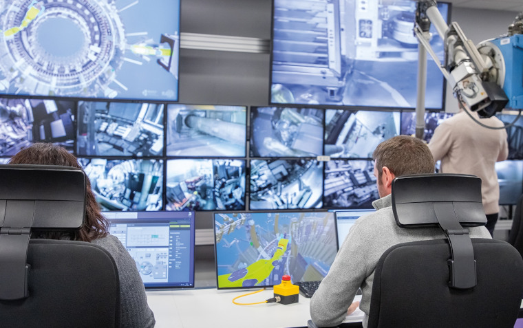 Experts operating robots on the report operations in challenging environments training course.