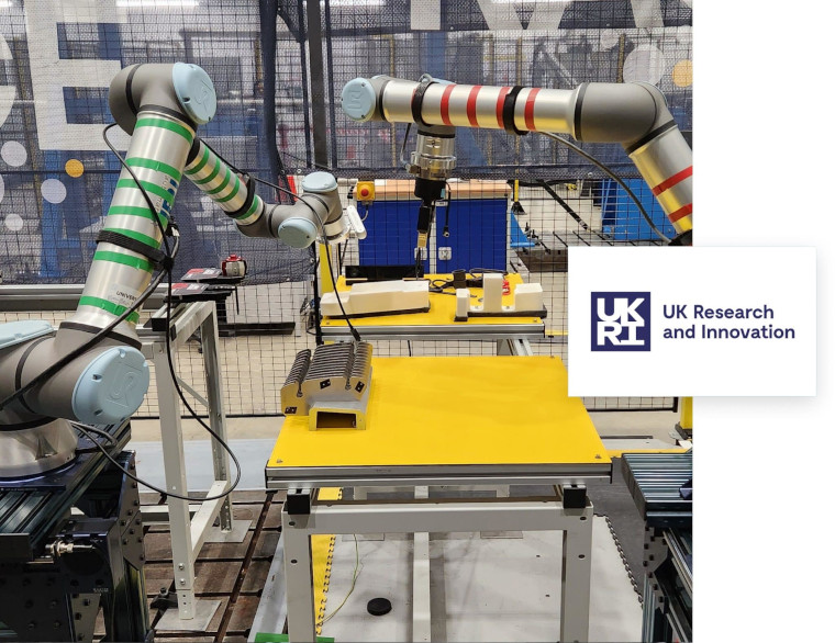 Robot arms working - with the UKRI (UK Research and Innovation) logo overlayed.