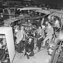 A team of scientists and engineers with TOSCA -a small tokamak device