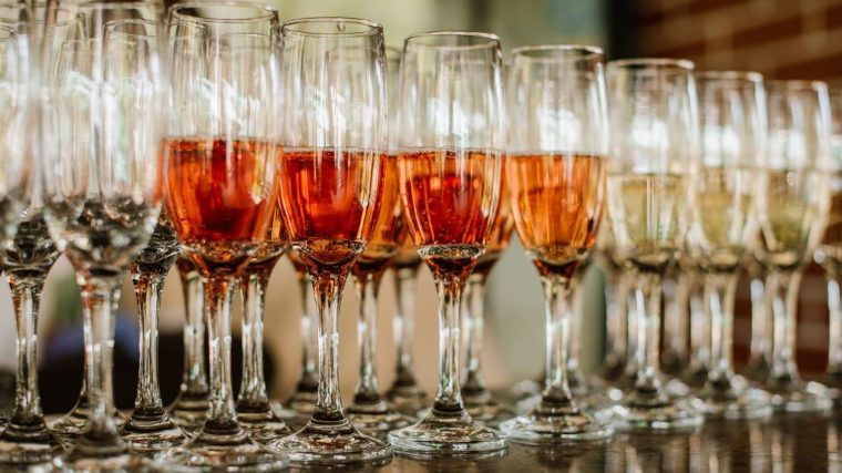 drinks in glasses lined up ready for a welcome.