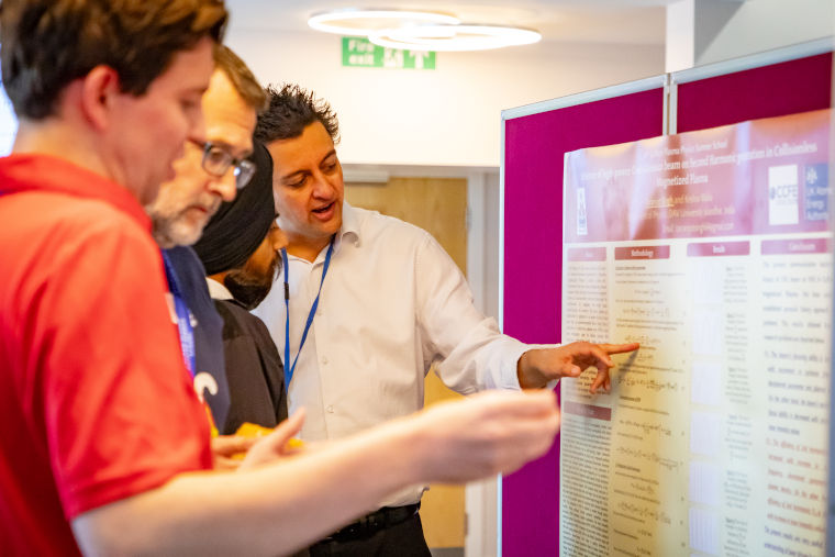 Experts and students at the Culham Plasma Physics Summer School discuss the poster sessions organised by students.