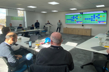 Decommissioning and repurposing experts in a workshop.