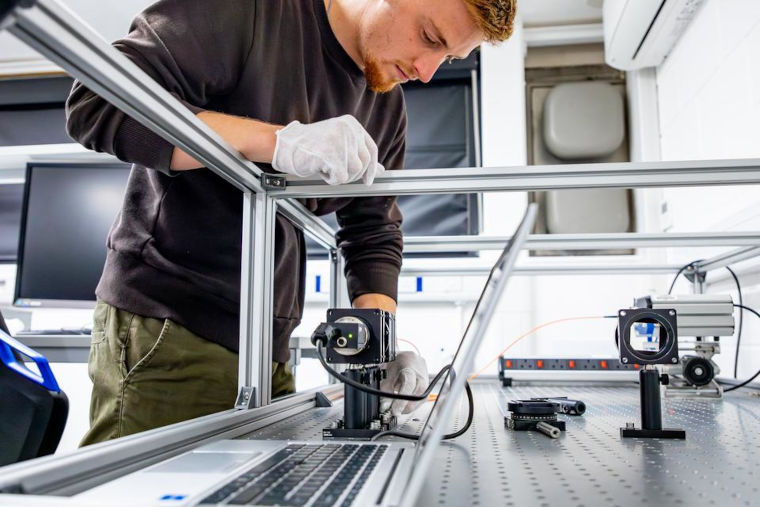 An expert working on a fusion energy experiment at UKAEA.