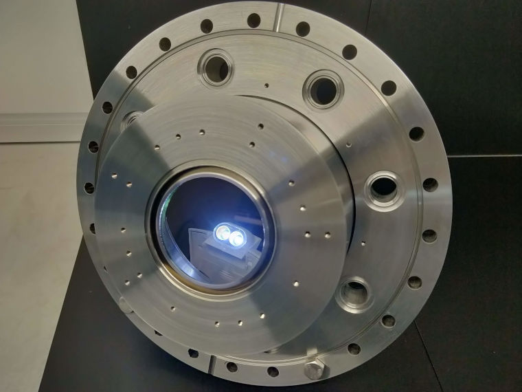 A specialist viewport with a small machine with 2 lights shining through the window section.